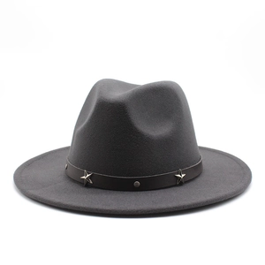 Detailed close-up of dark grey wool fedora with a star-studded leather hatband decoration