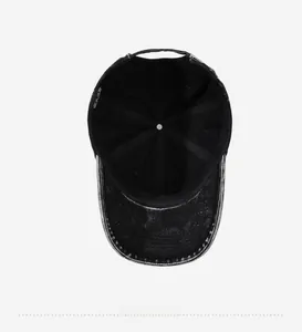 Detailed interior of washed black denim baseball cap with sweatband and quality stitching