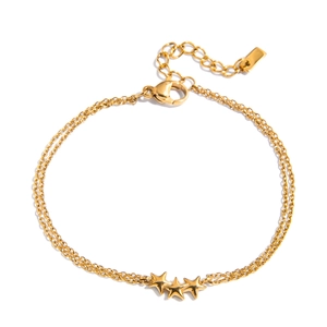Detail of gold double-layer star bracelet showing the lobster clasp and extension chain