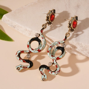Vintage snake drop earrings in antique gold with colorful enamel and red crystals