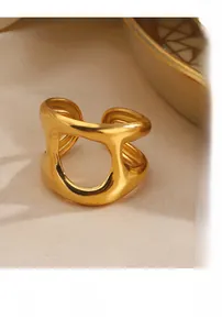 Macro shot of 18K gold plated hollow chunky ring with polished organic liquid metal lines