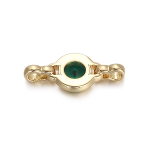 Macro shot of gold-plated circular emerald zircon connector for DIY bracelet making