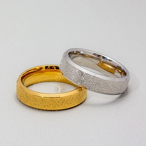 Minimalist 6mm gold and silver stainless steel rings with a matte sandblasted finish