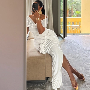 Elegant white off-shoulder maxi dress with pleated details and a high side slit