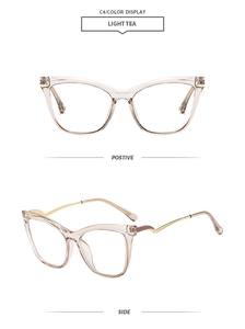 Detail of light tea cat eye glasses frame with elegant golden wavy metal temples