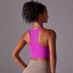 Rear view of purple racerback yoga bra paired with beige high-waisted fitness leggings