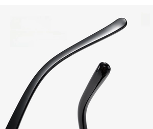 Macro shot of curved ergonomic temples on glossy black square fashion sunglasses