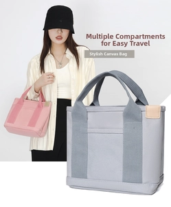 Detail view of the spacious inner compartments and durable wide handle of canvas tote bag