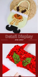 Detail of Christmas gift bag with sequins, plush white trim, and 3D reindeer antler accents