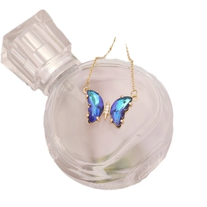 Elegant gold butterfly necklace with gradient blue crystals and small diamonds for women