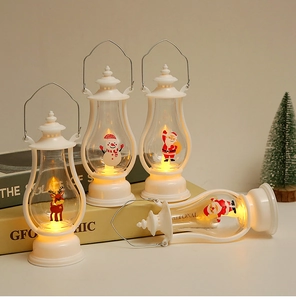 Detail of white vintage LED Christmas lanterns featuring reindeer and snowman patterns