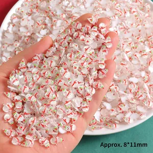 Close-up of 8x11mm resin Christmas snowman charms for DIY crafts and nail art