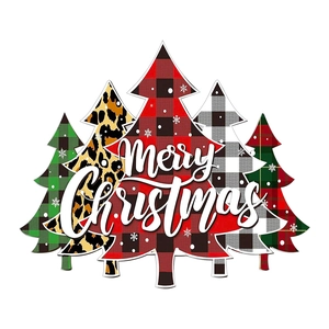 Detail of five decorative Christmas trees with plaid and leopard patterns for home decor
