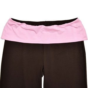 Close-up of high-waist yoga pants featuring pink fold-over waistband and dark brown fabric