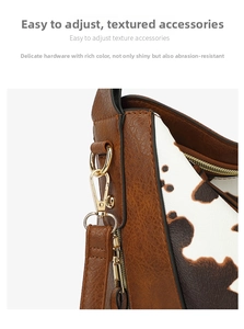 Detail of vintage brown pebble leather bag with cow print side and gold metal hardware