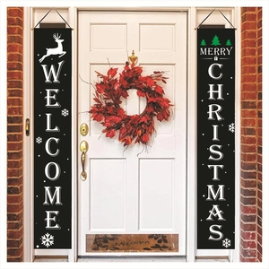Vertical Welcome and Merry Christmas banners hanging on a white door for holiday decoration