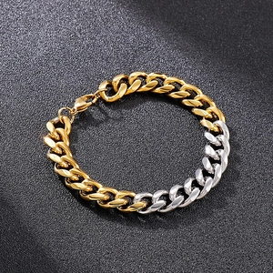 Detail of two-tone gold and silver Cuban link bracelet with a lobster clasp closure