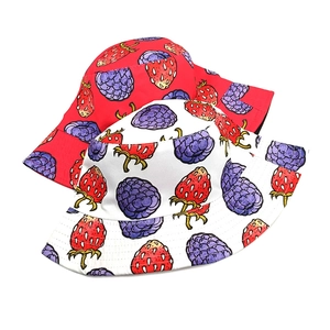 Reversible bucket hat with creative strawberry and pineapple print in red and white