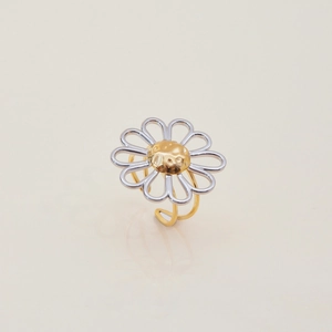 Macro detail of two-tone daisy flower ring with silver petals and golden hammered center