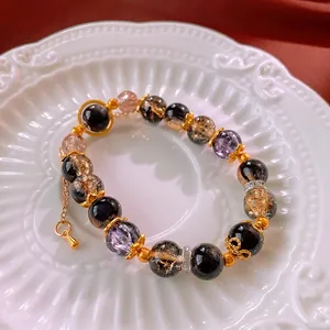Neo-Chinese geometric beaded bracelet with translucent crystal beads and gold metal accents