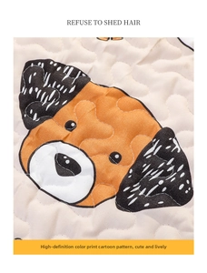 Close-up of quilted fabric pet mat with cartoon dog print and anti-shedding texture