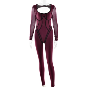 Detail showing maroon yoga bodysuit with black trim and transparent mesh sleeves