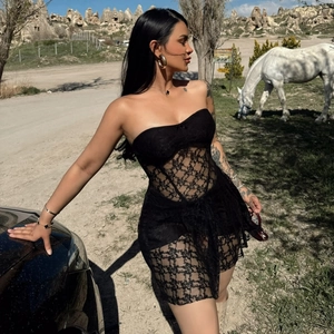 Chic black lace tube mini dress for summer vacation featuring sheer floral textures