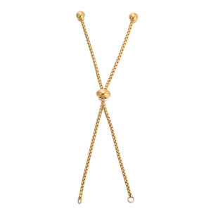 Macro detail of golden stainless steel box chain with an adjustable slider bead