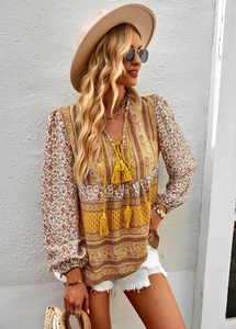 Bohemian floral print shirt for women featuring a V-neck and decorative tassels