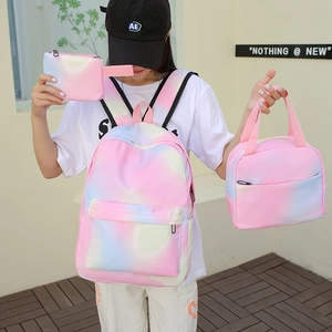 Three-piece pink and blue gradient backpack set including lunch bag and pencil case