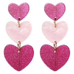 Three-tier pink acrylic heart earrings with glitter finish and golden metal links