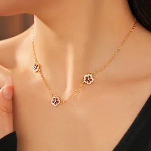 Elegant 18K gold plated necklace with three zircon flower pendants and red center stones
