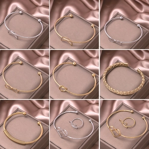 Minimalist gold and silver heart-shaped open cuff bracelets with high polish metal finish