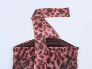 Detailed close-up of pink leopard print mesh top showing the halter neck tie texture