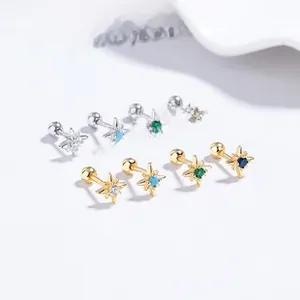 Detailed macro view of S925 sterling silver star studs with colorful zircon and screw backs