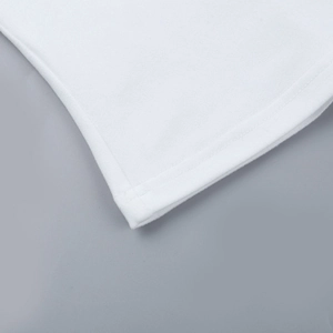 Close-up of the delicate white lace hem and stitching on this long sleeve blouse