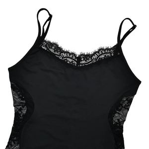 Close-up of V-neck lace trim and sheer side stitching on this black sexy bodysuit