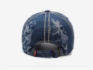 Detail of adjustable metal buckle and strap on a vintage washed denim baseball cap