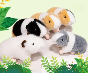 Detailed view of four colorful plush guinea pig toys in white, black, grey and brown colors