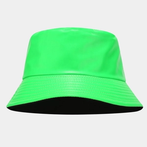Detail view of fluorescent green PU leather bucket hat with precise brim stitching