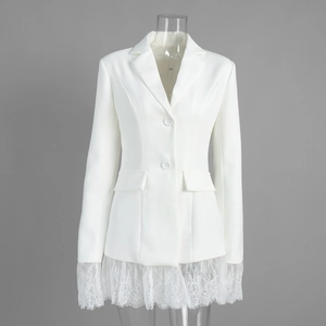 Detailed close-up of white blazer jacket featuring exquisite lace trim on sleeves and hem