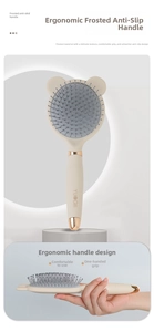 Detail of beige bear-ear air cushion hairbrush with a frosted anti-slip handle and gold accent