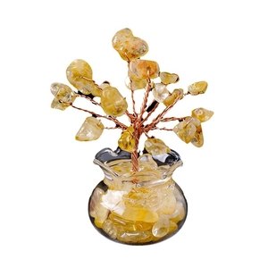 Natural yellow crystal money tree decor with citrine stones and glass vase on white background