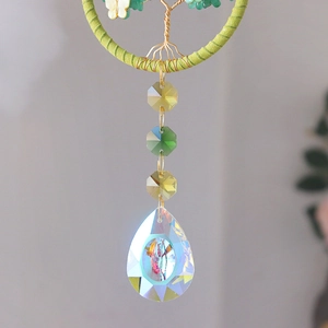 Close-up of Life of Tree crystal suncatcher with AB aura teardrop pendant and beads