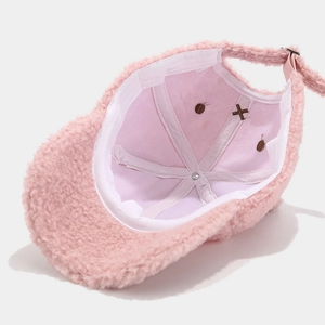 Pink plush baseball cap with rabbit ears and interior adjustable metal buckle strap