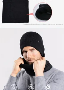 Detail of warm black knitted beanie and neck warmer set with thick fleece lining