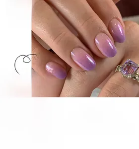 Detail of almond-shaped purple gradient press-on nails with fine glitter finish
