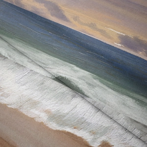 Detail of soft flannel beach tapestry showing fine plush texture and ocean waves print