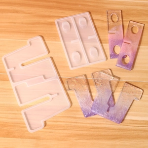 Macro detail of silicone resin molds and finished purple gradient glitter epoxy pieces