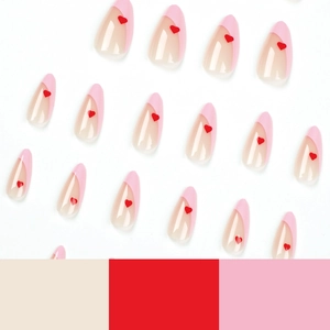 Almond press-on nails with pink French tips and red heart accents on a white background